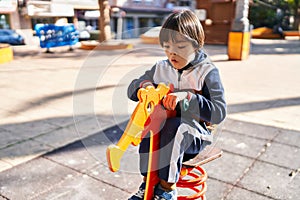 Down syndrome kid playing at park