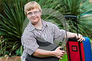 Down syndrome student with file and trolley.