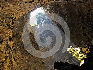 Down view of earth hole and light in cave  Castellana Grotte  Puglia