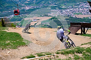 Downhill mountain bikers riding down the trail on Pohorje near Maribor, Slovenia