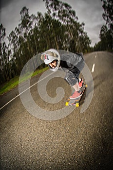 Downhill skateboarder in action