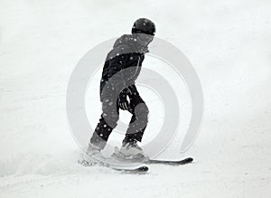 Downhill skier in black