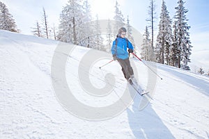 Downhill skiing background, skier in mountains