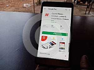 Opera news online android app displayed on smart phone screen holded hand mobile concept in India dec 2019