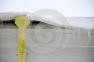 Downpipe and icicles on the roof