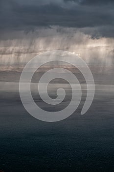 Downpour over the lake. The Dead Sea, Jordan