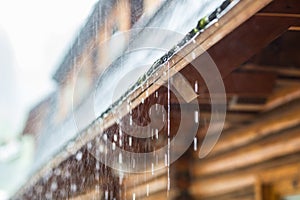 Downpour in the summer storm and rain drops on the roof