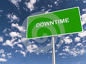 downtime traffic sign on blue sky photo