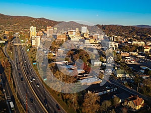 Downtown Asheville, North Carolina. Aerial drone view of the city in the Blue Ridge Mountains during Autumn / Fall Season.  Archit