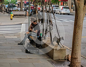 Street musician plays music in Asheville