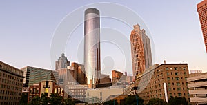 Downtown Atlanta Skyline showing several prominent buildings, apartments, offices and hotels under a blue sky