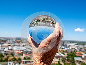 Downtown Bloemfontein through a solid glass ball.