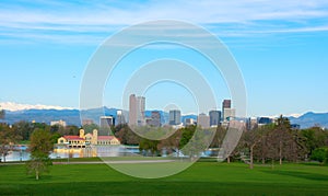 Downtown Denver panoramic skyline buildings with snowcapped mountains and trees