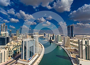 Downtown Dubai from drone. Amazing city center skyline with luxury skyscrapers on a sunny day, United Arab Emirates