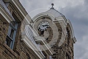 Downtown Fergus.  Ancient stone house with clock, photo
