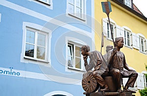 Downtown Fussen fountain and statue, surrounding with restaurants, near Neuschwanstein Castle,south part of Bavaria, Germany