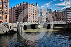 Downtown Hamburg on a cloudy day. Boats passing on the waterways.