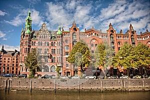 Downtown Hamburg on a cloudy day. Boats passing on the waterways.