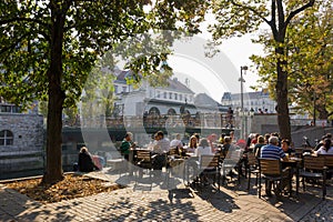 Downtown Ljubljana street along canal, by Buther`s bridge, famou