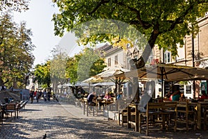 Downtown Ljubljana street along canal, famouse tourist place on