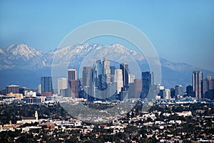 Downtown Los Angeles against snowy mountains