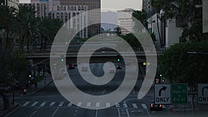 Downtown Los Angeles street view with busy traffic. Evening traffic on the downtown streets.