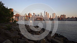 Downtown Manhattan View close to water with Brooklyn Bridge in Beautiful Sunrise Sunlight in Summer Water, Morning