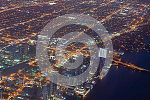 Downtown Miami lights at night from departing aircraft