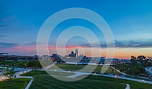 Downtown Omaha at dusk as the sun sets as seen from Council Bluff