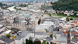 Downtown of Salzburg city in Austria, top view from Hohensalzburg Fortress on a cloudy sommer day.