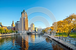 Downtown skyline with Buildings along the Milwaukee River photo