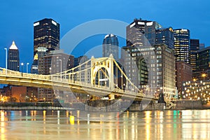 Downtown skyline and Roberto Clemente Bridge over Allegheny River in Pittsburgh photo