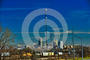 Downtown Skyline of Tulsa OK past a railyard and industrial area from route 66 museum