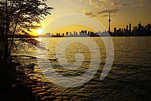 Downtown Toronto with iconic tower in sunset