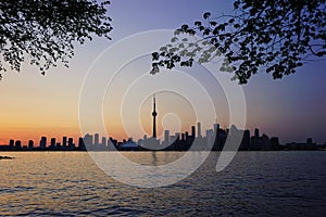 Downtown Toronto with iconic tower in sunset