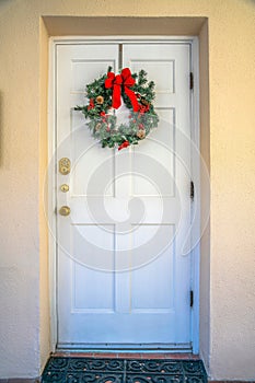 Downtown Tucson, Arizona- White front door with decorative wreath