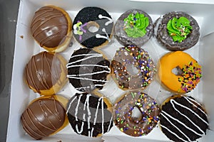 A dozen of Close-up Krispy Kreme Donuts photo
