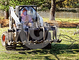 Dozer Hauling away tree debris