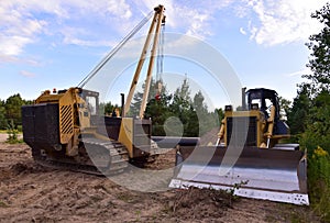 Dozer and Pipelayer with side boom o  Installation of  gas and crude oil pipes in ground. Construct of the gas pipes to new LNG