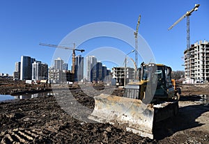 Dozer working at construction site. Bulldozer for land clearing, grading, pool excavation, utility trenching and foundation