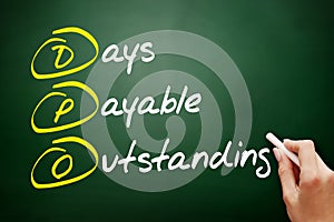 DPO - Days Payable Outstanding acronym, business concept on blackboard photo