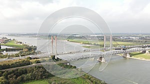 Dr. W. Hupkesbrug and Martinus Nijhoffbrug aerial drone view highway infrastructure bridge over a large waterway in The