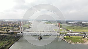 Dr. W. Hupkesbrug and Martinus Nijhoffbrug aerial drone view highway infrastructure bridge over a large waterway in The