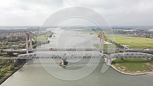 Dr. W. Hupkesbrug and Martinus Nijhoffbrug aerial drone view highway infrastructure bridge over a large waterway in The