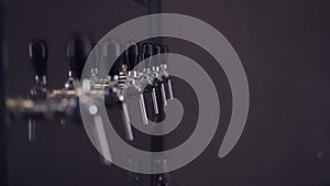 Draft Beer Taps In A Brewery - rack focus