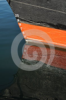 Draft Markings on red and black boat