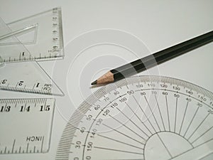 Drafting tools and pencil are on white background 2.