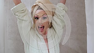 Drag queen person singing in the shower.