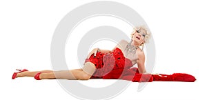 Drag Queen in Red Dress with Fur Lying on the Floor