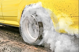 Drag racing car burn tire in preparation for the race